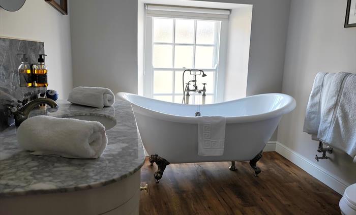 Extra large super king bathroom, traditional free standing roll top bath in our light and fresh bathroom